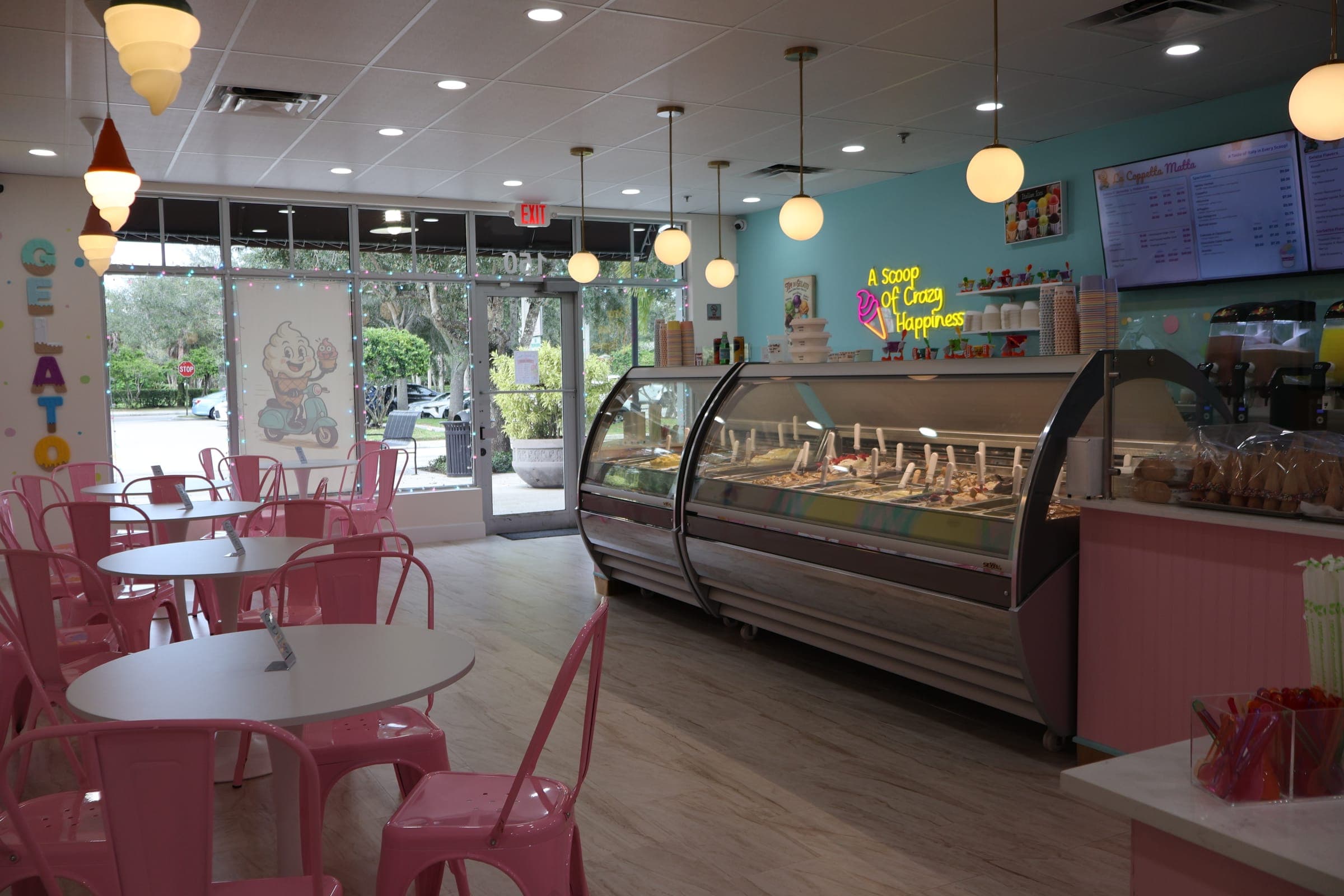 Inside La Coppetta Matta: pink chairs, mint walls and the gelato case